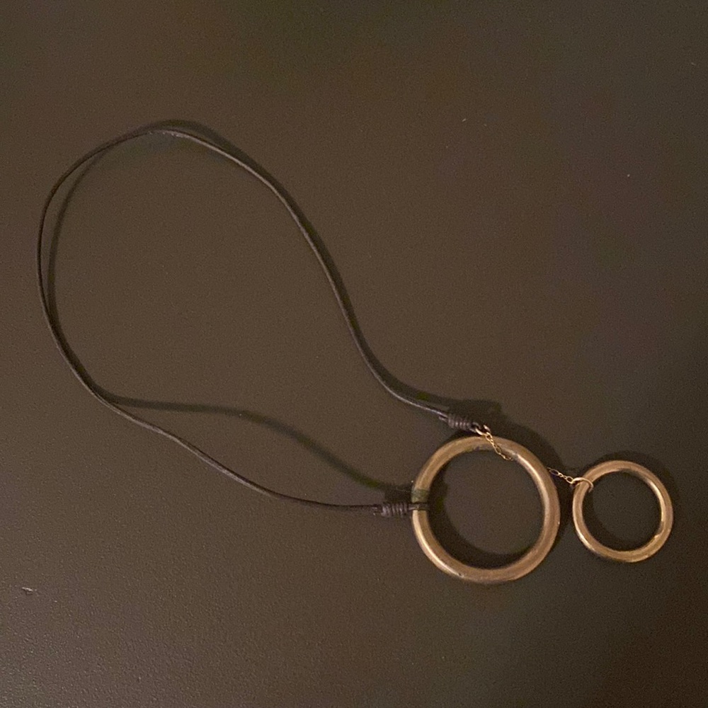 Brown leather and brass necklace.